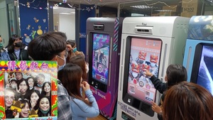 IMICS students were interacting with PICBOT, a smart photo booth with AR capabilities. (Photo by IMICS)(Open new window/jpg file)