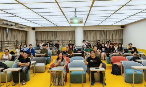 Distinguished Professor Trisha Lin (front row, center), students from Innovative Media and Creativity, and guest speaker Ming (front row, right) pose for a group photo after the lecture. The session provided students with valuable insights into generative-AI applications in video creation. (Photo by GCIT)(Open new window)