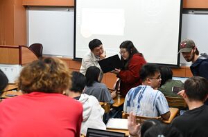 During the class, Assistant Professor Chiou adopted a task-based and collaborative learning design, moving among groups to observe discussions and provide immediate guidance and language feedback. (Photo credit: EMI Resource Center)(Open new window/jpg file)Image