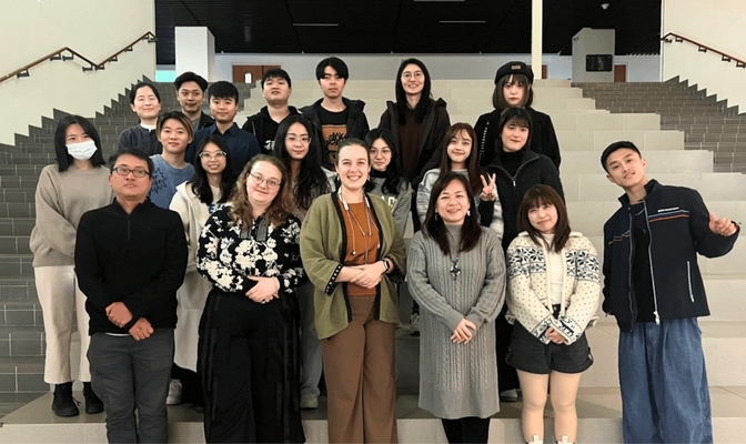 Group photo of event attendees, with NCCU GCIT Director Professor Trisha Lin in the front row, third from the right, and Assistant Professor Christine Cook at the center of the front row. (Photo by GCIT)